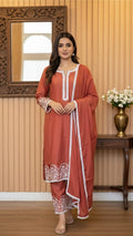 Burnt orange modal kurta pant and dupatta with white lace work